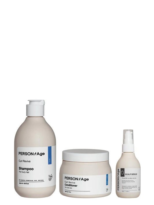 PersontAge CURL CARE & NOURISHMENT Ritual kit hair care product set including shampoo, conditioner, and serum on a white background