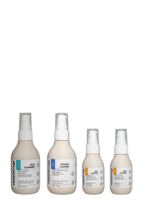Four bottles of brightening skincare products ritual kit on a white background