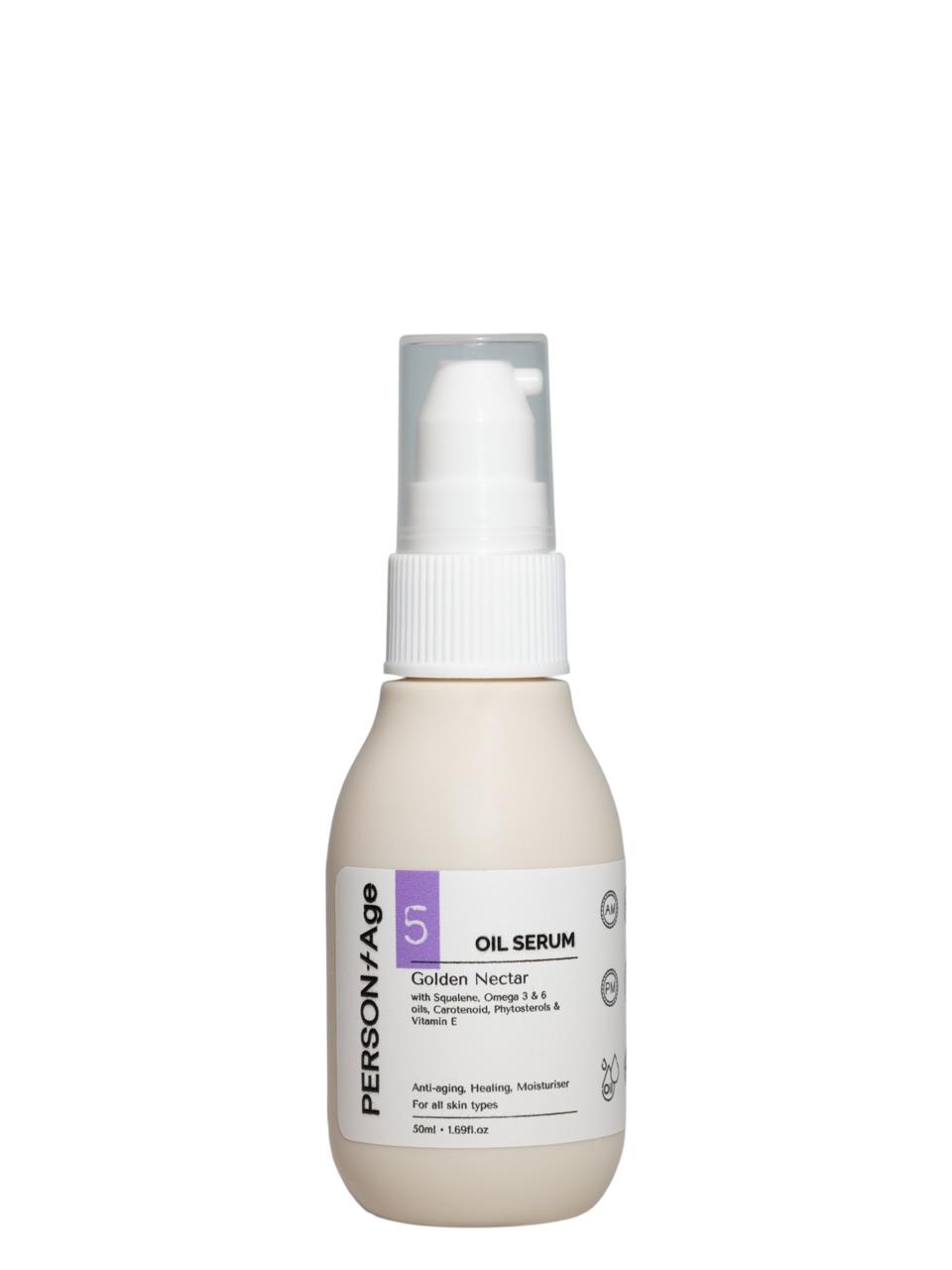 Skincare serum bottle labeled 'PersontAge GOLDEN NECTAR on a white background