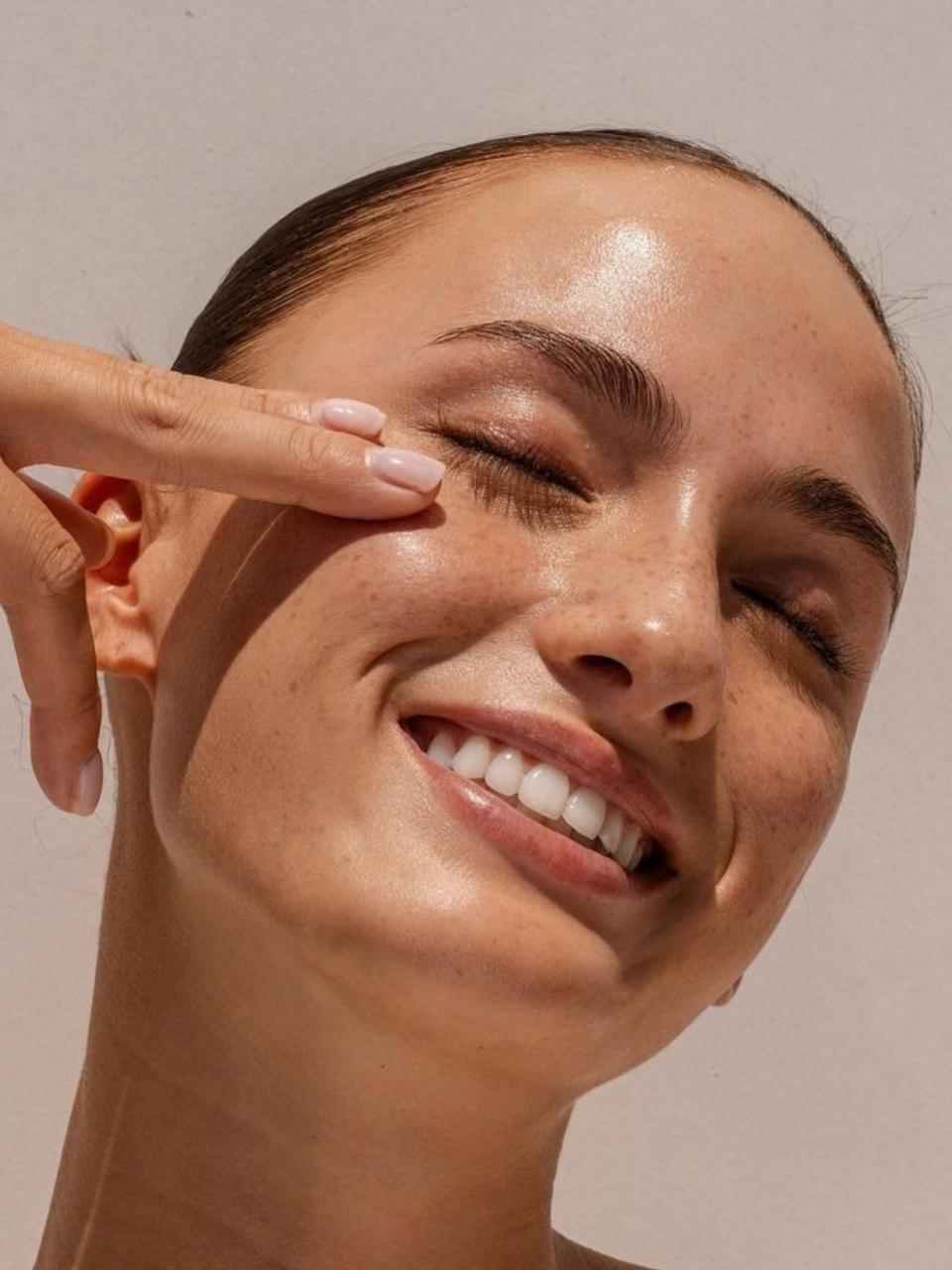Close-up of a woman's face with a neutral background for ANTI-PIGMENTATION ROUTINE – Skin Lightening Routine Kit.