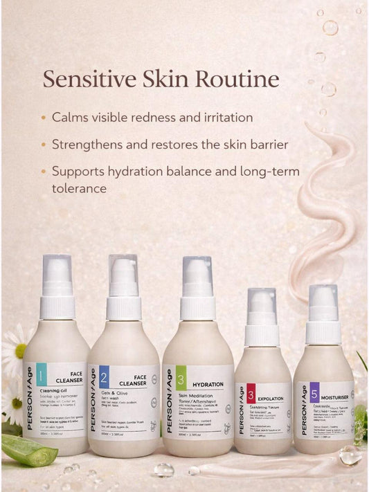 Set of skincare bottles labeled 'Sensitive Skin Routine' on a light background